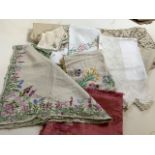 A quantity of vintage table cloths, napkins and tray cloths. Some hand embroidered