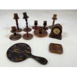 a quantity of tortoise shell style items including a hand mirror, a cigarette case a clock and