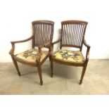 A pair of colonial style oak dining chairs with tapered front. H:45cm