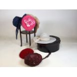 A vintage hat box with a quantity of vintage hats also with a circular small two tier Table H:56cm