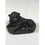 A bronzed brass seated lion W:13cm x H:8cm