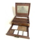 A Victorian oak and brass bound artists box with ceramic pallets, with Ackerman and co original