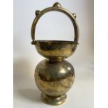 An Indian holy water brass carrier. H:55cm