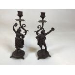 A pair of bronzed style spelter figurine candlesticks H:30cm