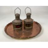 A Copper beaten tray also with a pair of small ships lantern port and starboard with green and red