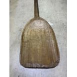 A 19th century a malt shovel. H:135cm