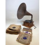 A wind up a gramophone with a quantity of 78s