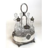 Large silver plate and cut glass condiment caddy. Six piece cruet set with shakers, mustard pot