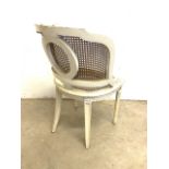 A pair of cream painted French rattan chairs with fluted legs. Seat height H:46cm