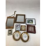 Two vintage mirrors. One with gilded wooden frame and one with metal frame. Also with framed