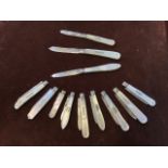 Quantity of hallmarked silver fruit knives with mother of pearl handles, 12 total, each has a