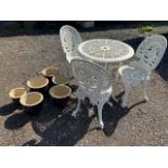 A metal garden bistro set, table and three chairs also with a collection of ceramic pots. Table W: