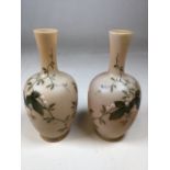 A pair of hand painted opaline glass vases marked III /64 to base H:22cm