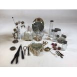 A collection of vintage dressing table items including hat pins and stands, pin dolls, button hooks,