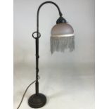 A vintage adjustable lamp with a glass beaded shade H:66cm Extends to 77cm high