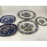 Large meat platters and serving dishes, Japanese style and blue and white willow pattern.