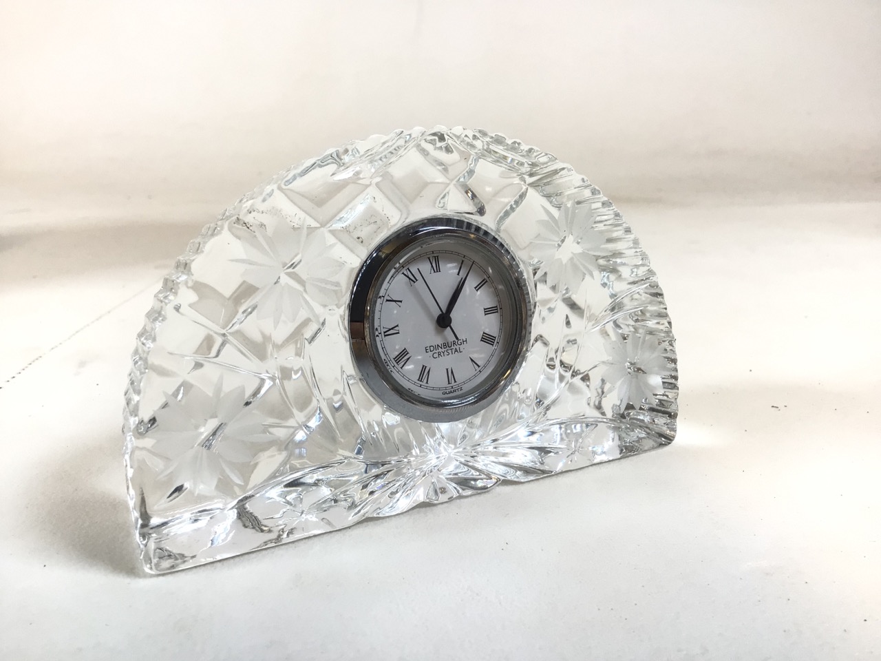 Edinburgh Crystal Quartz clock. Etched foliate pattern to face. Roman numerals to the removable