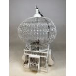 A mid century painted wood and metal ornamental bird cage ( with black bird ) with chain W:41cm x