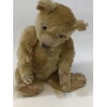 A vintage jointed teddy bear - no makers label H:37cm