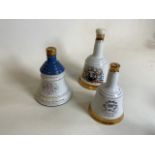 Three Bells Whisky commemorative ceramic decanters - two 75cl and one 50cl. Two with original seal