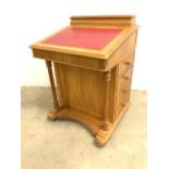 A modern good quality yew wood Davenport with red leather inset writing slope to internal storage