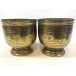 A pair of eastern brass containers. Decorated with deities and Eastern patterns. W:17cm x D:17cm x