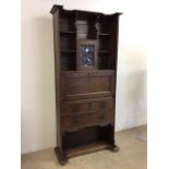 Rare Wylie and Lochhead oak secretaire bookcase designed by EA Taylor in Arts and Crafts taste.