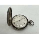 Full hunter pocket watch in hallmarked sterling silver case. 35mm diameter enamel face with Roman