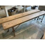 A pair of pine benches with metal folding legs and support stretcher. Each bench with breather