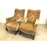 A pair of late 19th early 20th century upholstered button back arm chairs on brass and ceramic