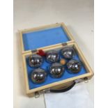 Traditional french boules in a wooden carry case