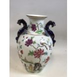 An oriental vase with blue dragon handles W:26cm x H:36cm