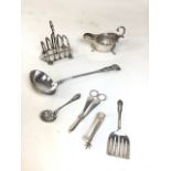Quantity of silver plate items, to include toast rack, gravy pot, large toddy ladle, grape