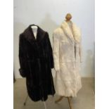 A full length cream coney fur coat in good condition together with another