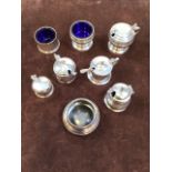 Hallmarked silver condiment pots, some with glass inserts, two with spoon. Total weight including