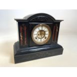 An early 20th century American slate mantle clock with dome top, marked Ansonia USA. Patented