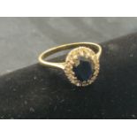A sapphire and diamond cocktail 9ct gold ring. Size R.