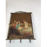 A tri-fold gilt dressing table mirror. Outer panels decorated with pastoral scenes. Hanging chain to