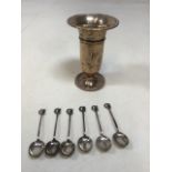 A set of silver tea spoons decorated with owls and a silver vase. Total weight 90 gm