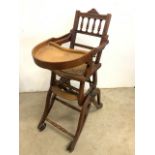 An early 20th century childs metamorphic high chair. Seater height H:58cm