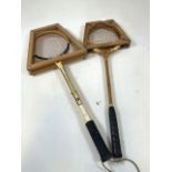 Two vintage racquets with with frames.