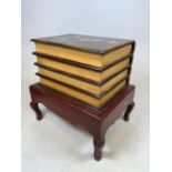 A Hand painted book coffee table with lift up lid to storage. W:56cm x D:44cm x H:56cm