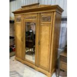 A good quality Satin wood triple wardrobe with large mirrored pin door. Interiors with deep