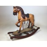 A vintage carousel style rocking horse on wooden rocker W:83cm x H:69cm