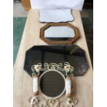 Three mid century mirrors with an ornate metal mirror and clothes brush set