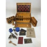 Games Compendium by F.H. Ayres. Early twentieth century. With wooden Chess pieces, bone dominoes