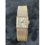 A 9ct white gold Tissot ladies watch.