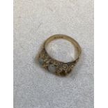 An 18ct gold Opal and diamond ring. One smaller opal missing, in ornate setting. Total weight 5.4gm.