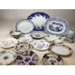 A large blue and white platter also with other platters and plates