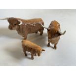 Beswick Highland cattle. A Bull and a Cow with horns also with a calf. In gloss finish. Bull and cow
